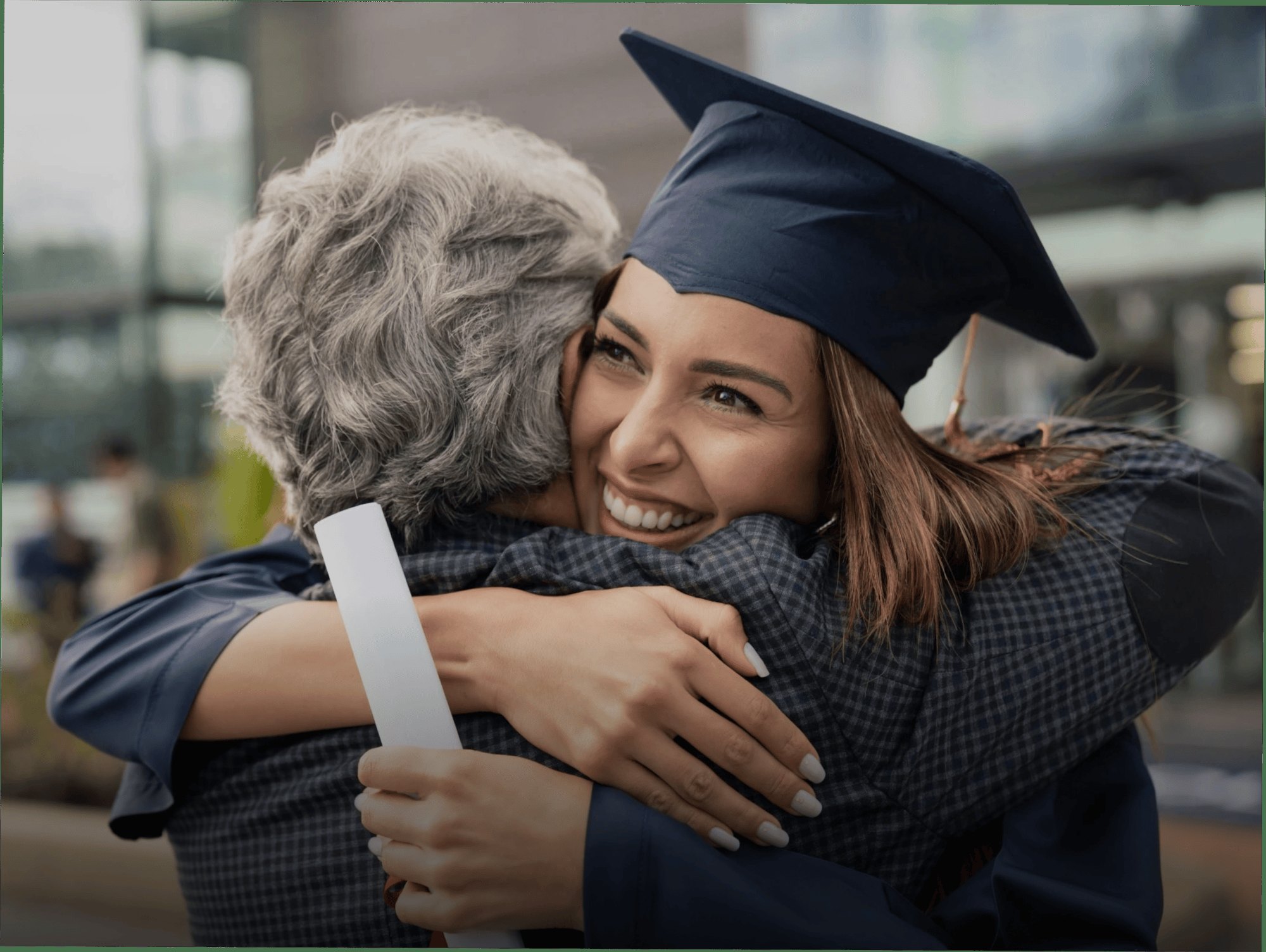Graduate embracing a family member, representing Kaplan’s learner-centered digital ecosystem